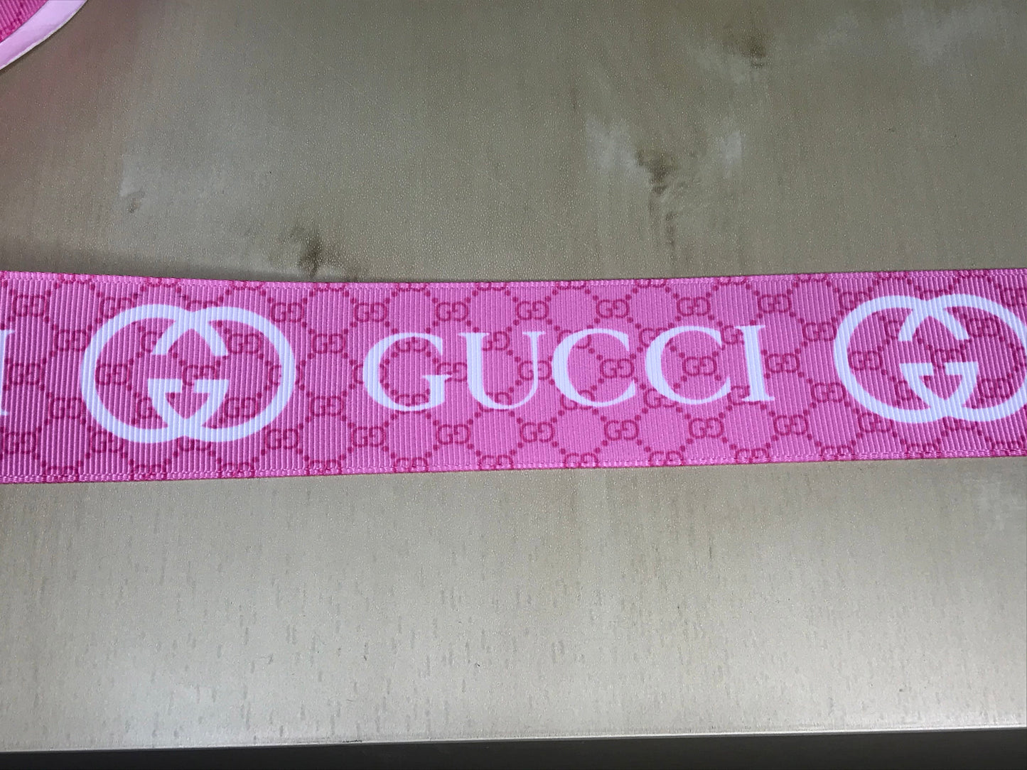 1-1/2" Wide Pink With White Lettering Gucci Printed Grosgrain Ribbon