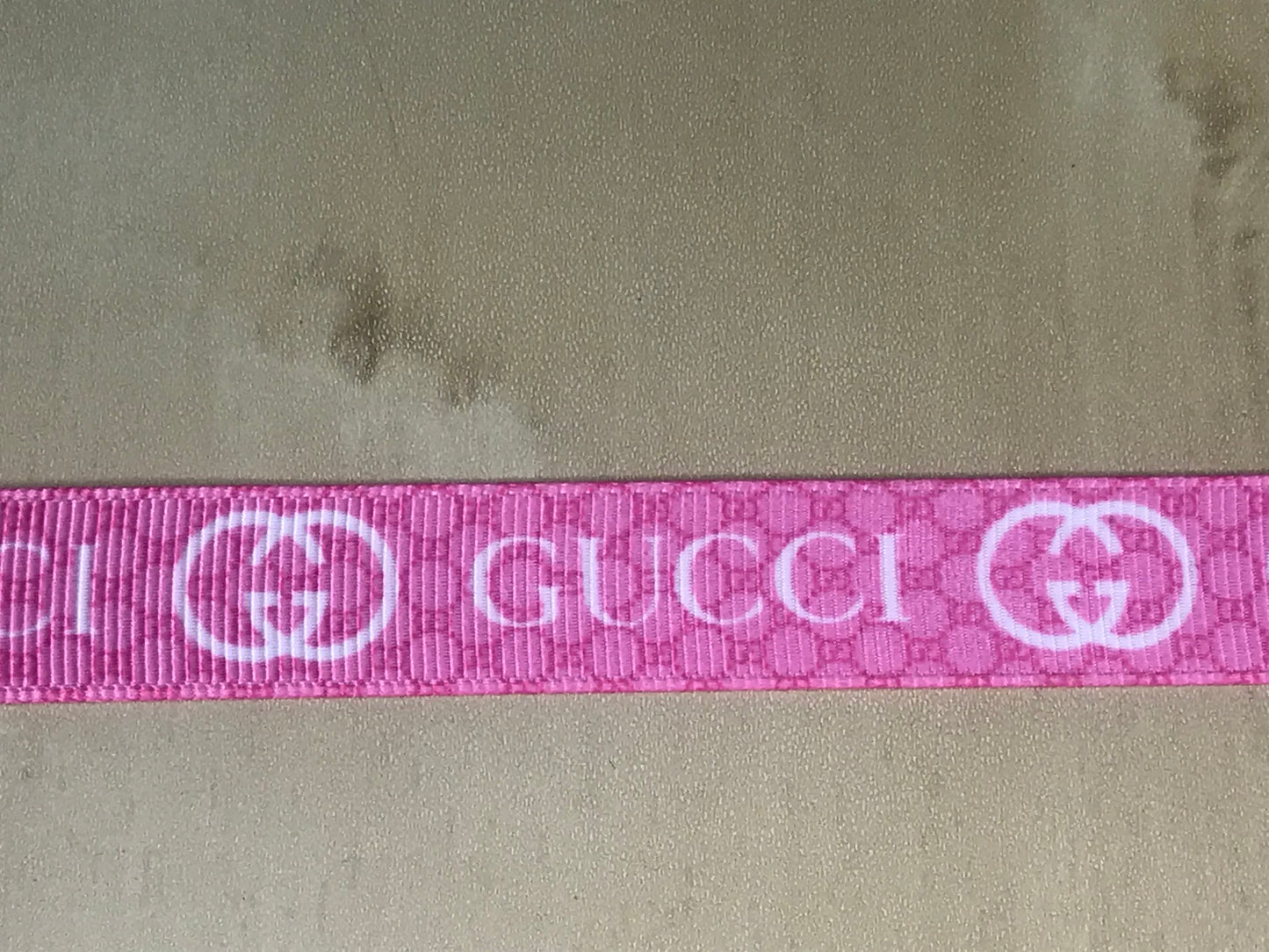 5/8" Wide Pink With White Lettering Gucci Printed Grosgrain Ribbon