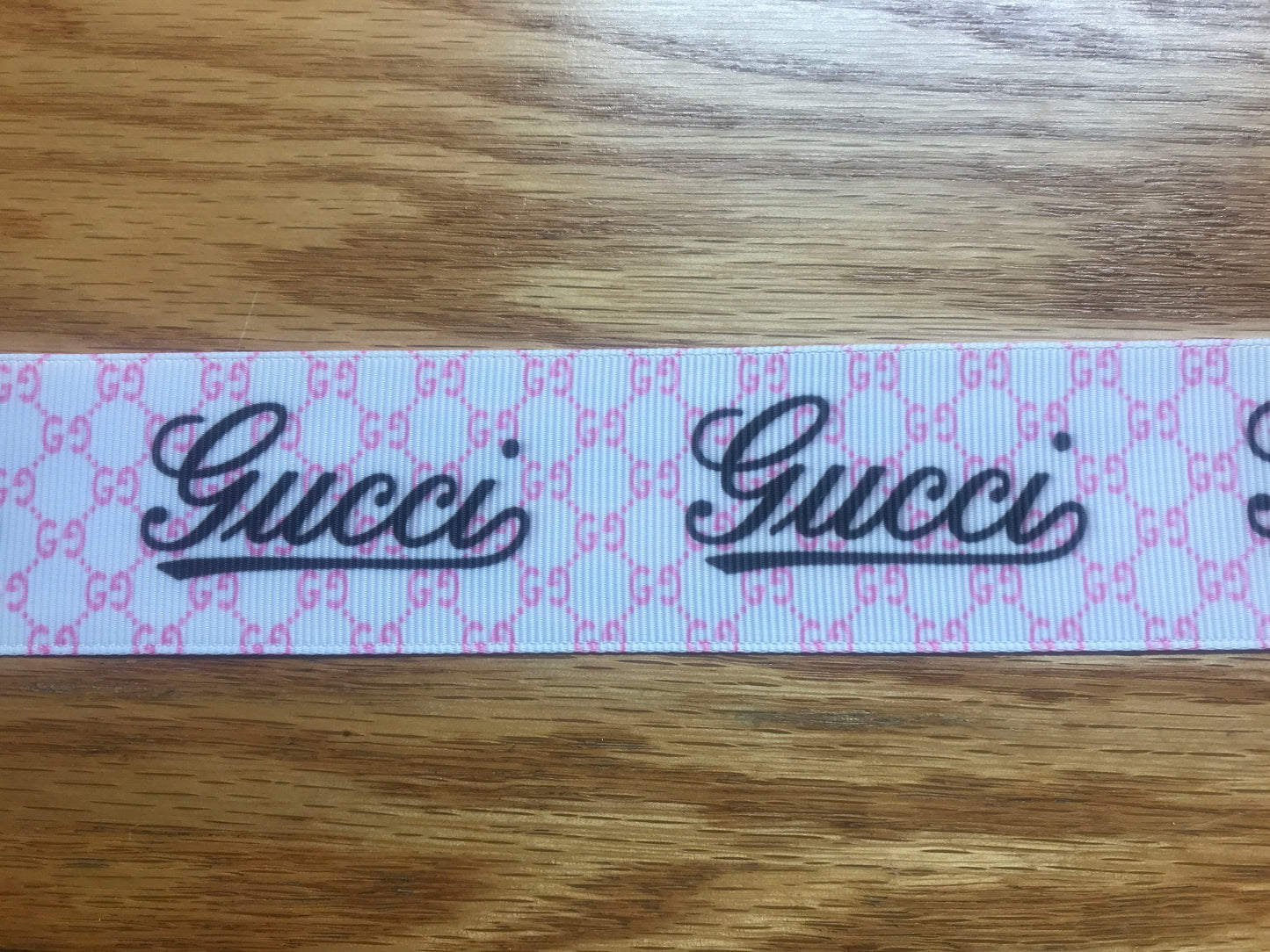 1-1/2" Wide Pink & White With Black Lettering Gucci Printed Grosgrain Ribbon