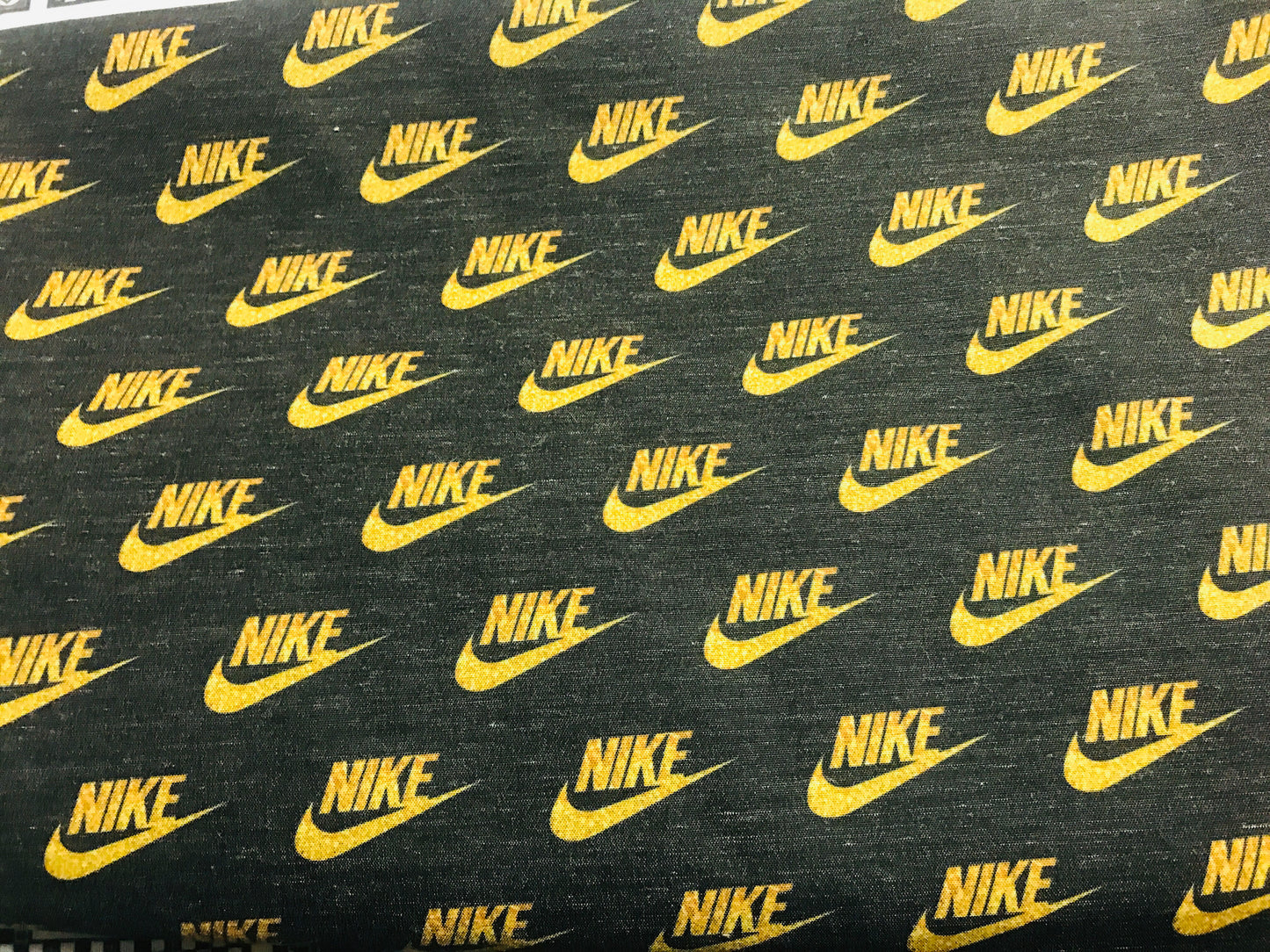 Black & Gold Nike Swoosh Logo Fabric
